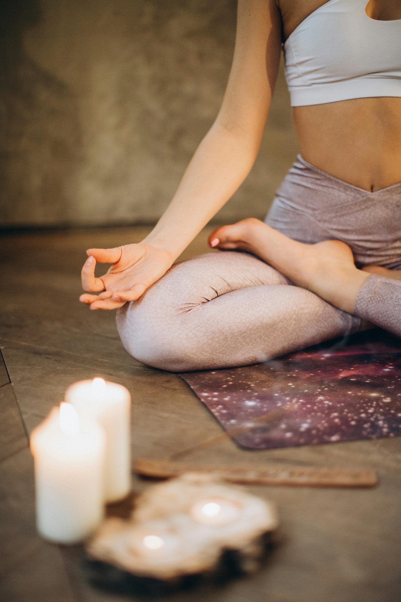 yoga meditation with lit candles